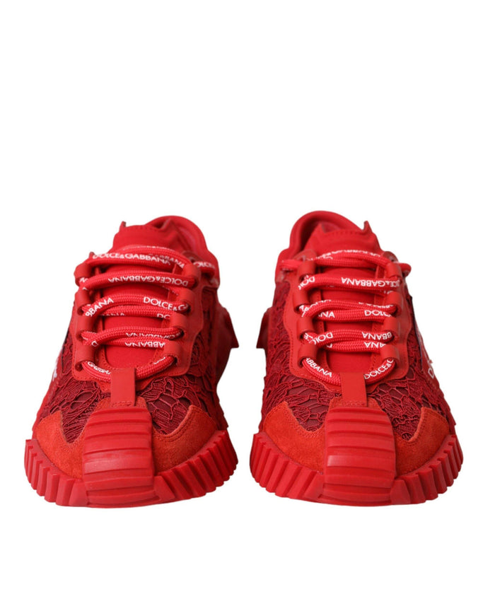 a pair of red sneakers on a white background