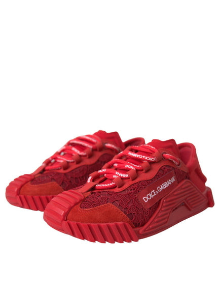 a pair of red sneakers on a white background