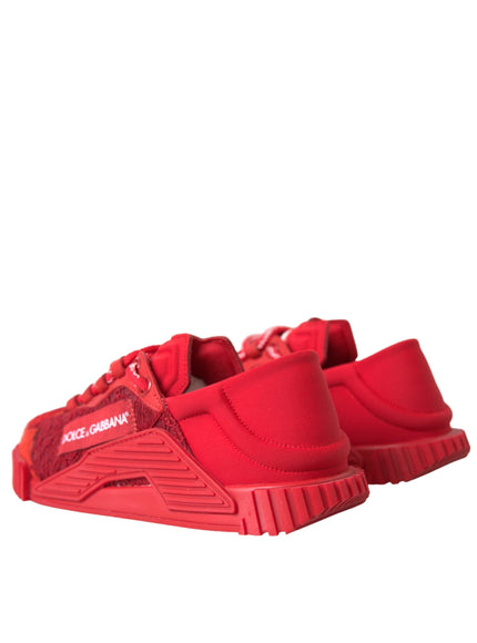 a pair of red sneakers on a white background