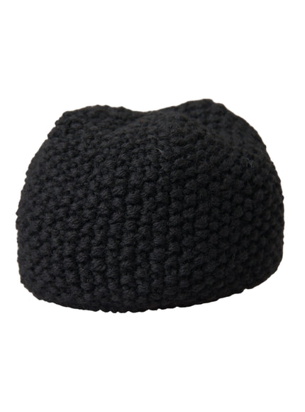 a black knitted beanie hat on a white background