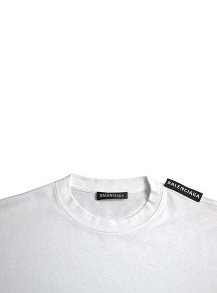 a white t - shirt with a black patch on the chest