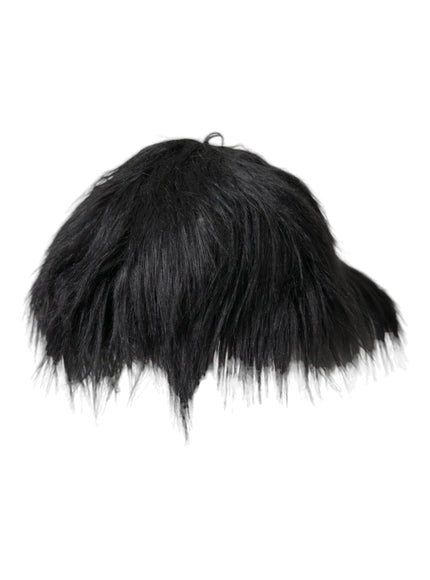 a close up of a black furry object on a white background