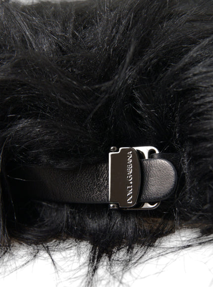 a close up of a black fur with a metal buckle