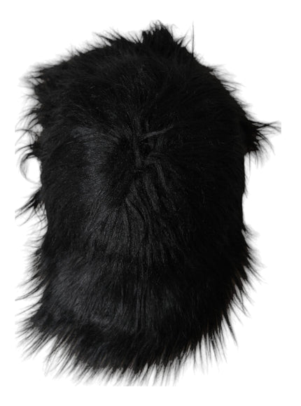 a black furry hat on a white background