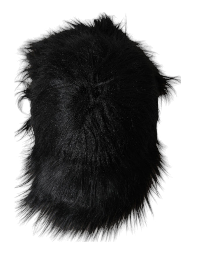 a black furry hat on a white background