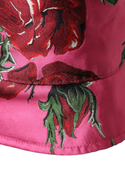 a pink hat with red flowers on it