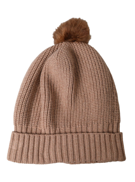 a brown hat with a brown pom pom