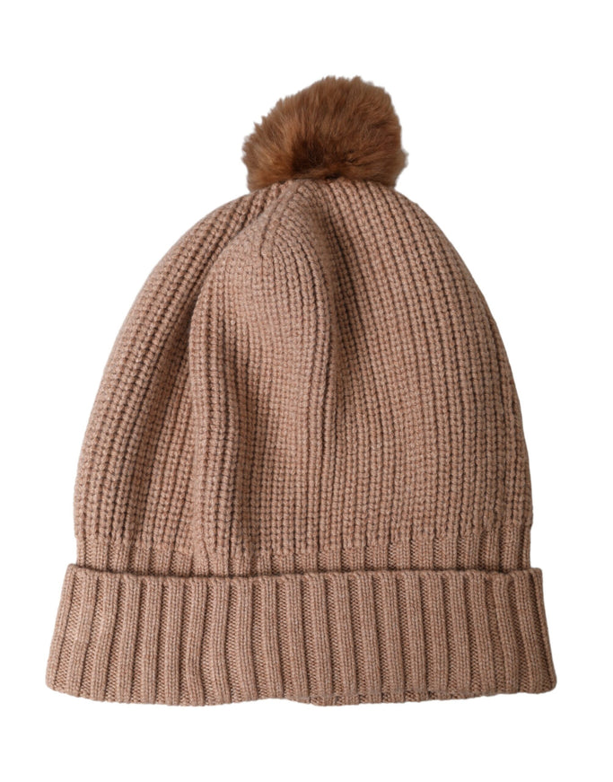 a brown hat with a brown pom pom