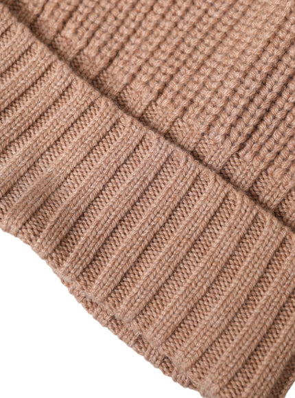 a close up of a brown knitted hat