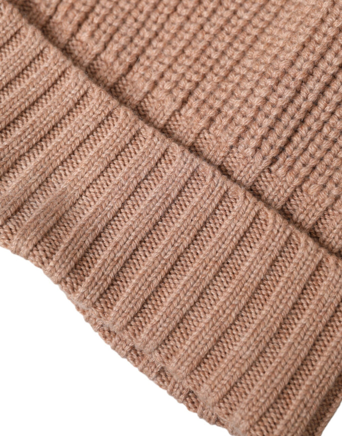 a close up of a brown knitted hat