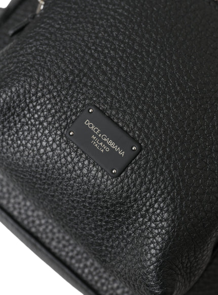 a close up of a black purse on a white background