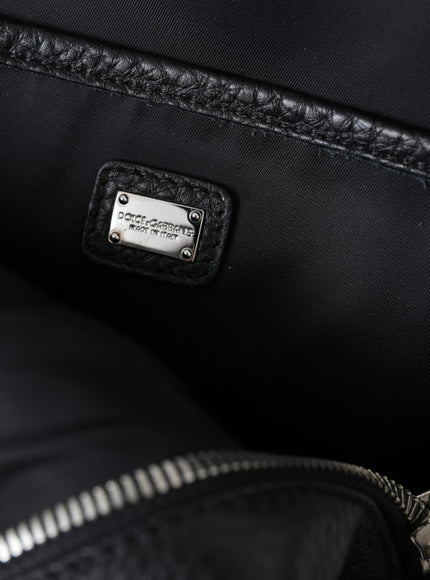 a close up of a black bag with a tag on it