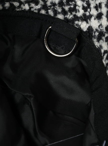 a close up of a bag with a metal ring on it