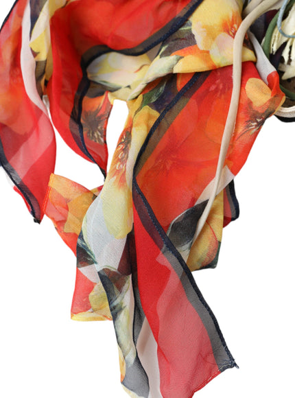 a red, yellow, and black scarf with flowers on it