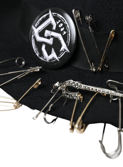 a black hat with a bunch of pins attached to it