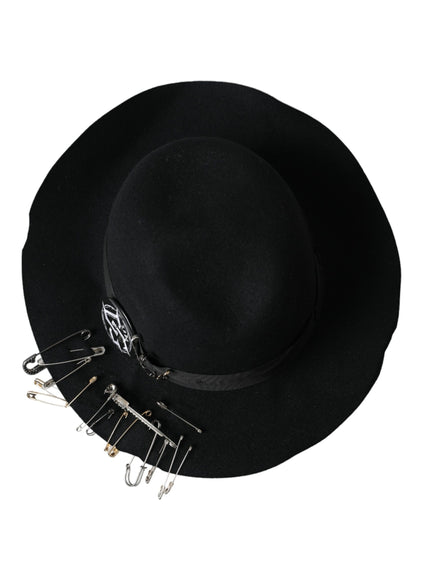 a black hat with a bunch of pins attached to it