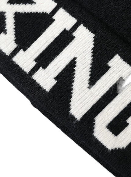 a black and white beanie with the word game on it