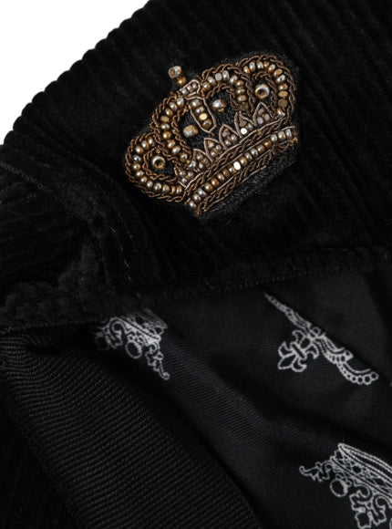 a black sweater with a gold crown on it