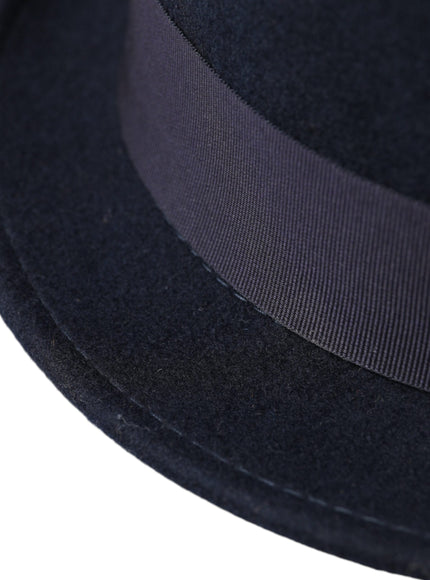 a close up of a black hat on a white background