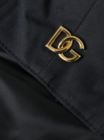 a close up of a black jacket with a gold buckle