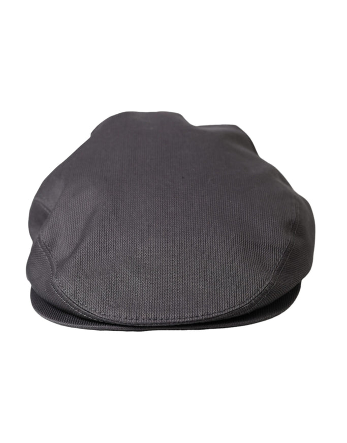 a close up of a black hat on a white background