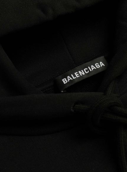 a label on a black shirt that says balenicaga