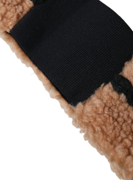 a close up of a black and brown mitten