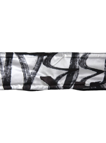 a black and white scarf with a design on it