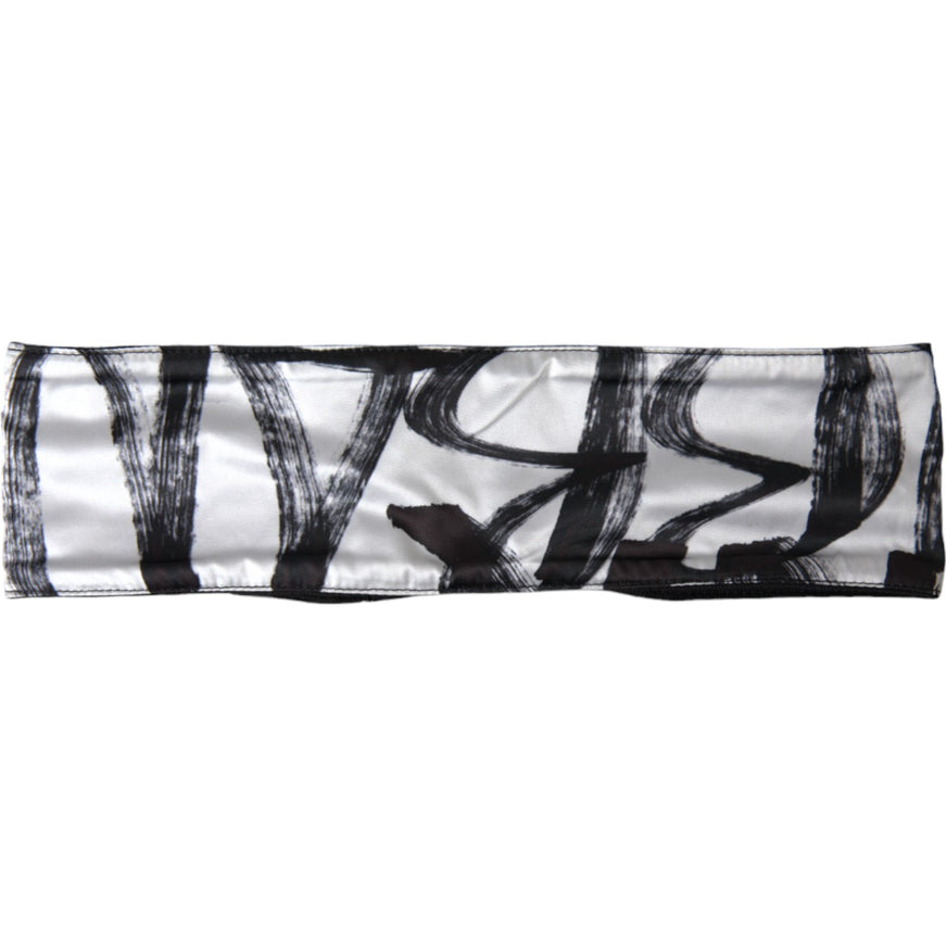 a black and white scarf with a design on it