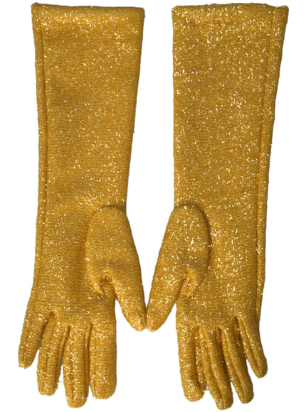 a pair of yellow glitter gloves on a white background