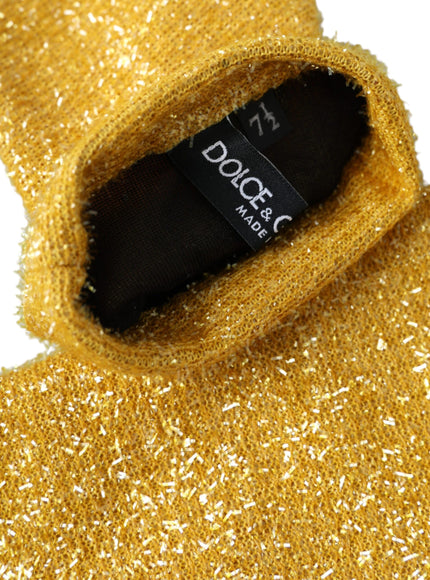 a close up of a gold colored sweater