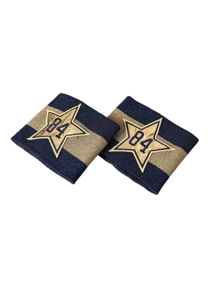 two blue and gold napkins with a star on them