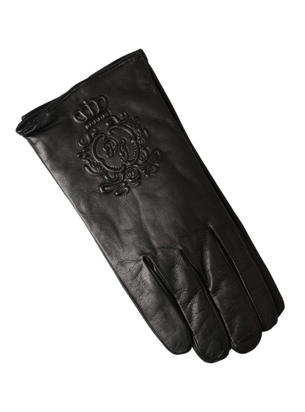 a pair of black leather gloves on a white background