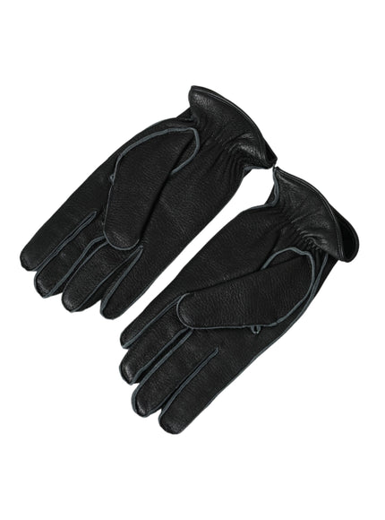 a pair of black leather gloves on a white background