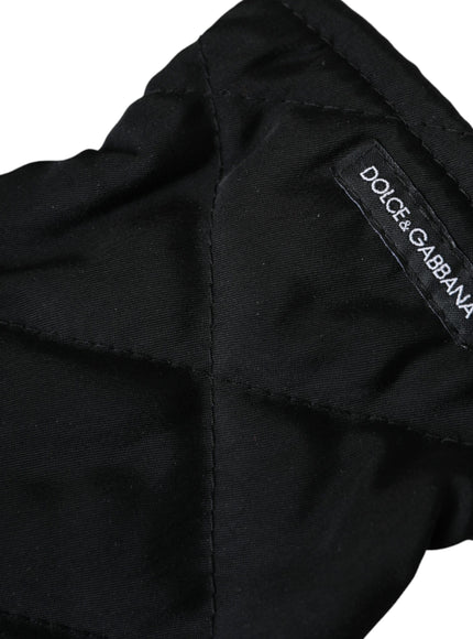 a close up of a black jacket with a label on it