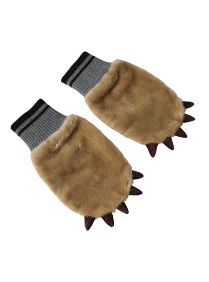 a pair of gloves with spikes on them