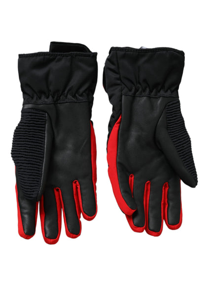 a pair of black and red gloves on a white background