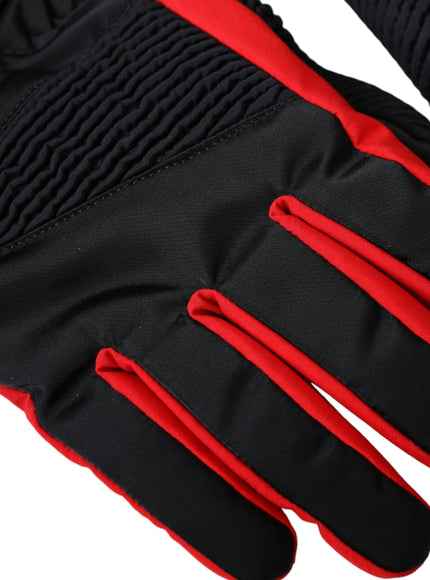 a pair of black and red gloves on a white background