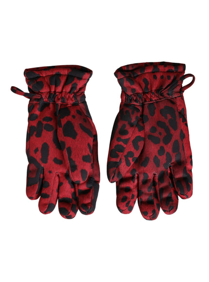 a pair of red and black gloves on a white background