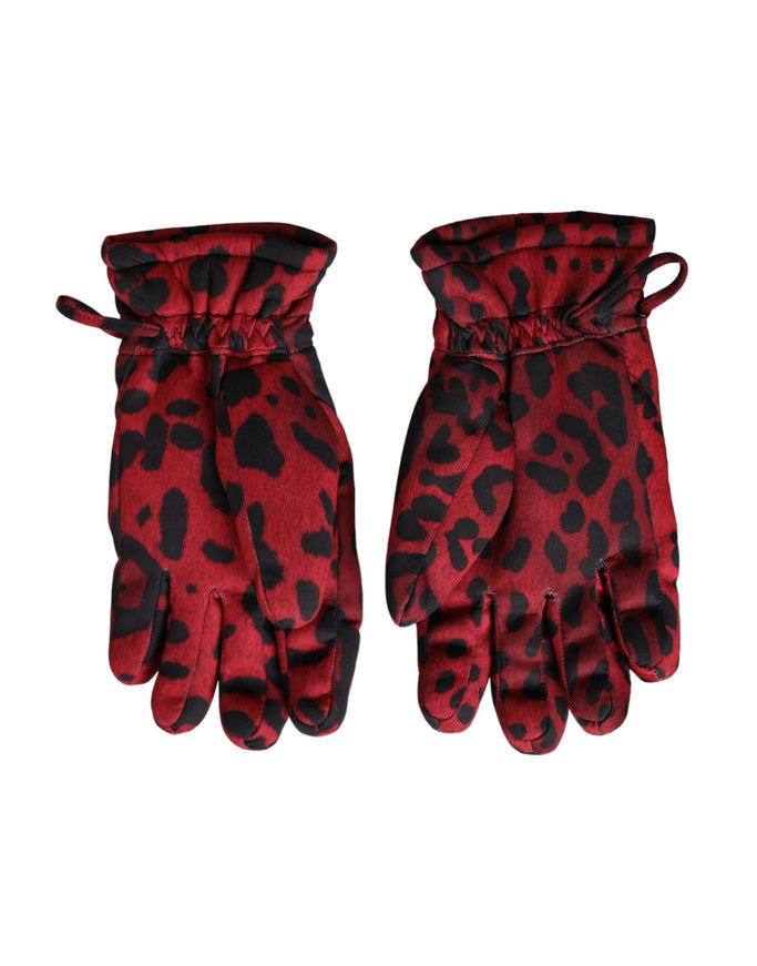 a pair of red and black gloves on a white background