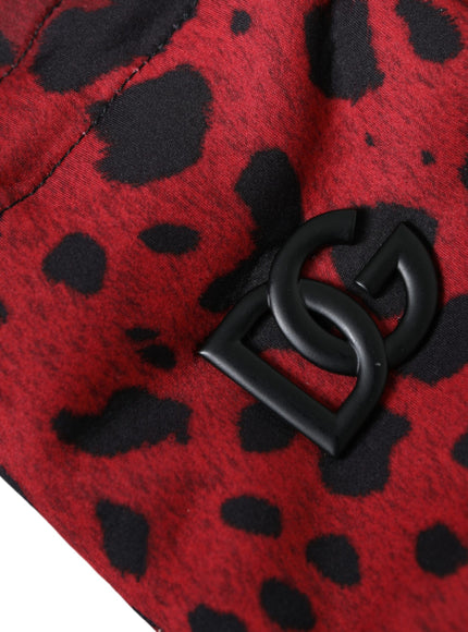 a close up of a red and black animal print pants