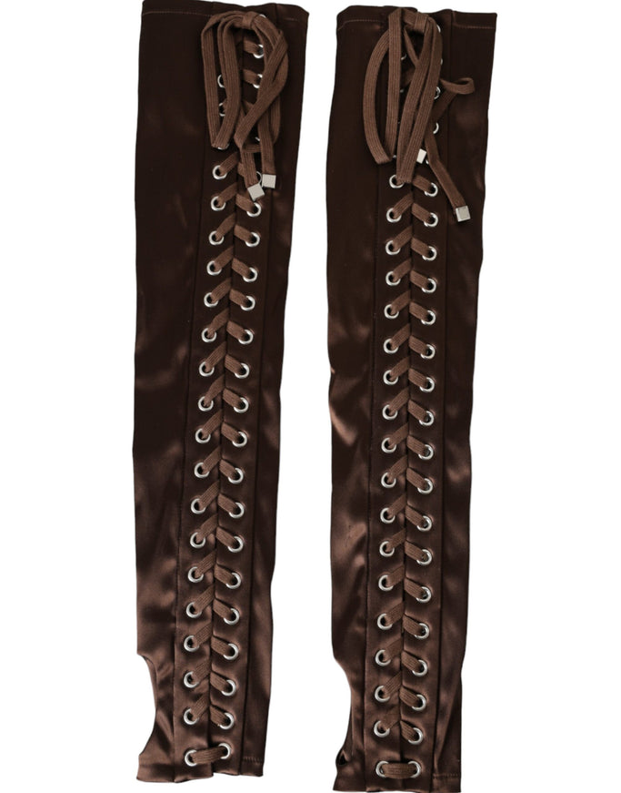 a pair of brown boots with laces on them