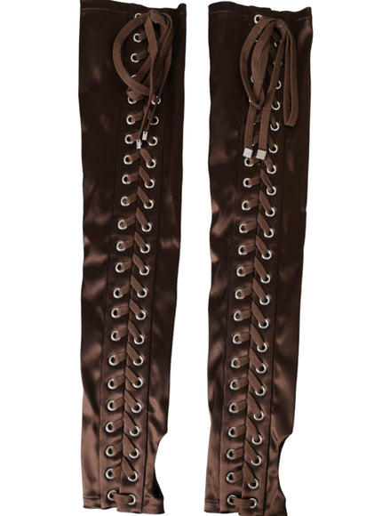 a pair of brown boots with laces on them