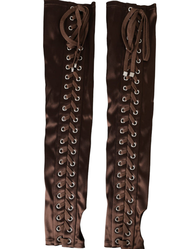 a pair of brown boots with laces on them