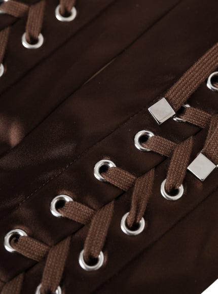 a close up of a brown bag with metal straps