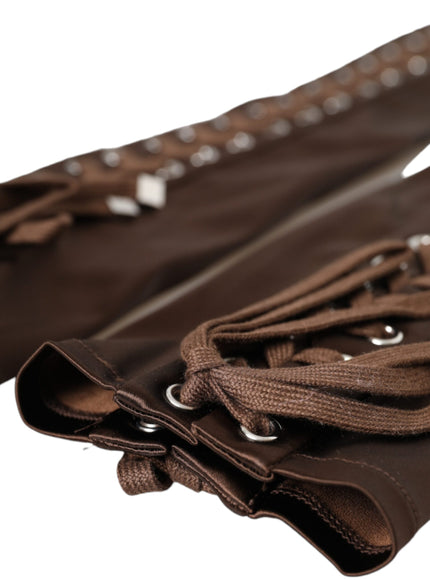 a close up of a pair of brown leather gloves