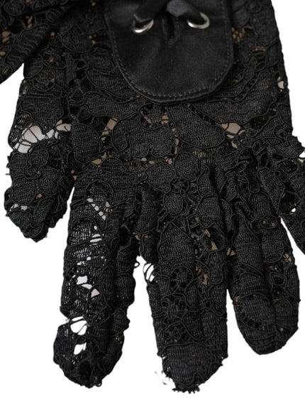 a pair of black gloves with lace on them