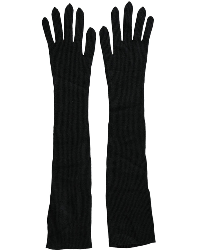 a pair of black gloves on a white background