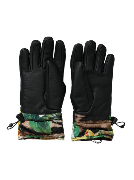 a pair of black gloves with palm leaves on them