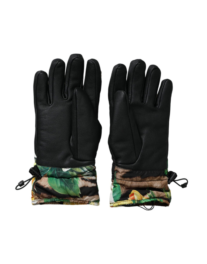 a pair of black gloves with palm leaves on them